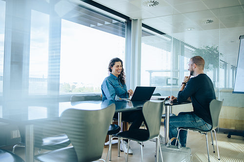 Businesswoman interviewing job candidate in boardroom