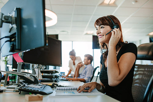 Casual businesswoman working at her desk
