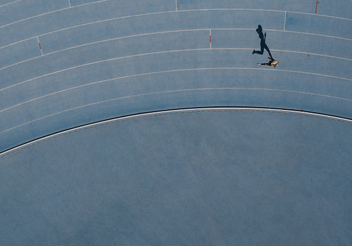 Aerial view of an athlete running on track