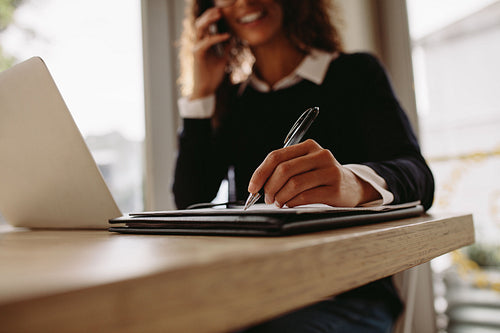 Woman working from a cafe