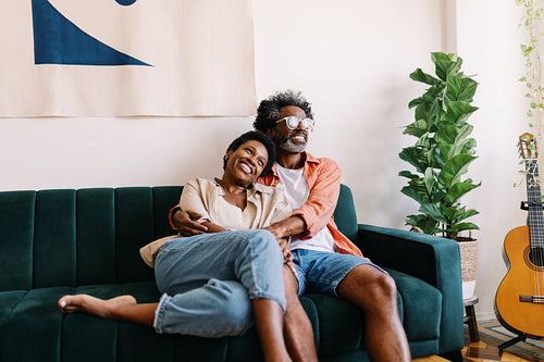 Mature husband and wife relaxing in their living room