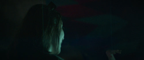 Young friends dancing at a festival under the lights