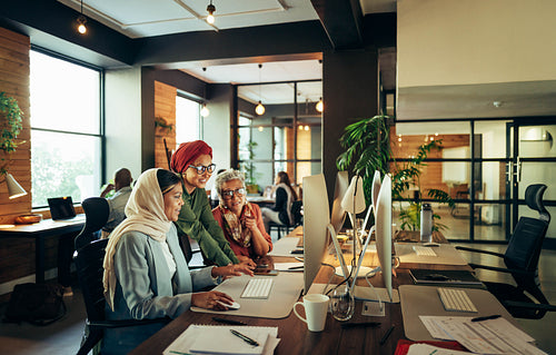Group of ethnic businesswomen working together in a coworking of
