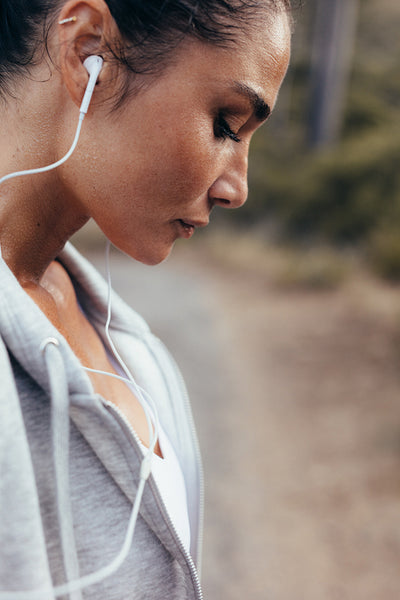 Tired fitness female resting after exercising