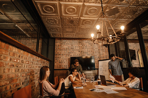 Group of young business professionals having a meeting