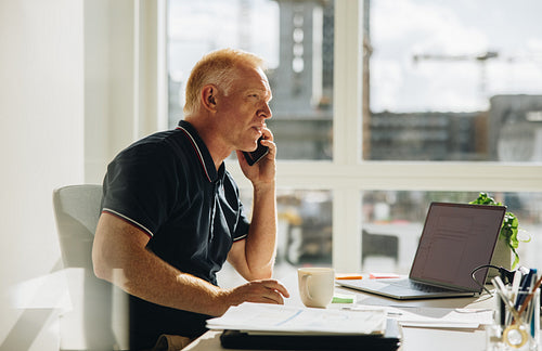 Senior businessman talking on phone