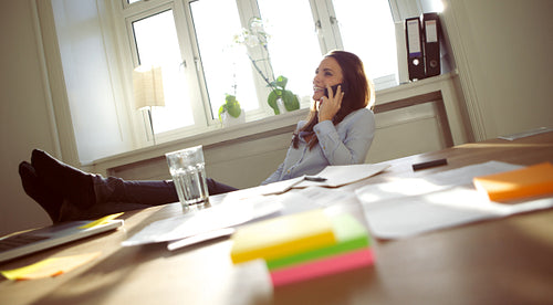 Beautiful business woman talking on cell phone