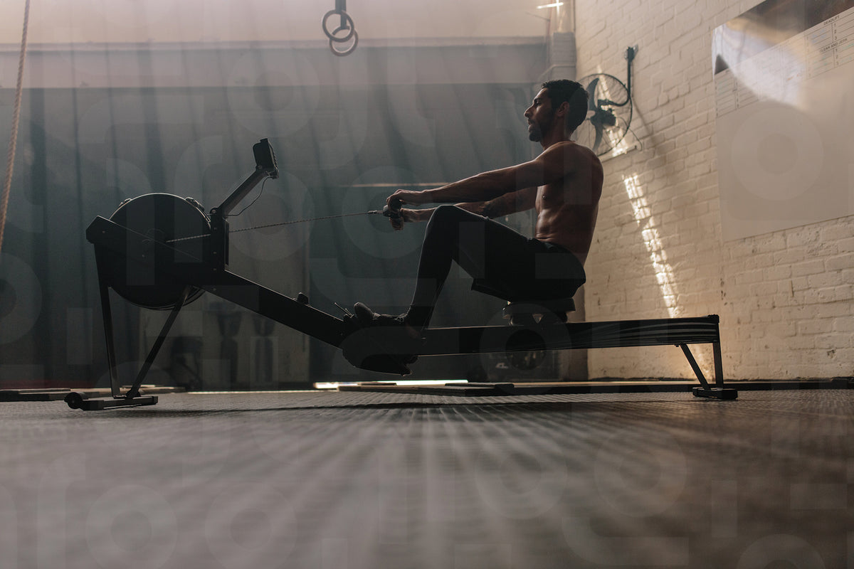 Male using rowing machine at fitness club – Jacob Lund Photography ...