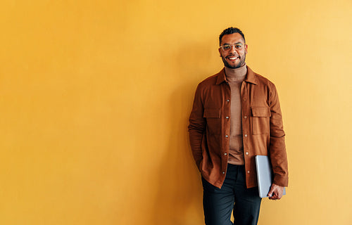 Successful businessman smiling at the camera in an office