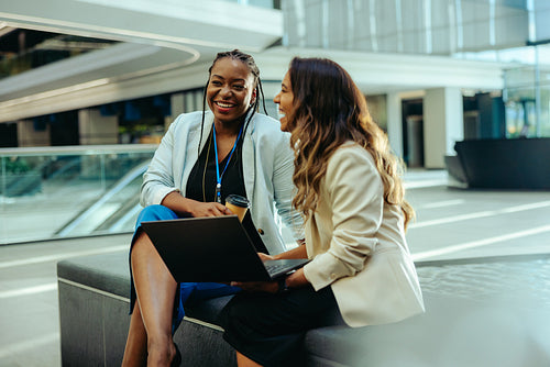 Friendly business meeting in modern office lounge area