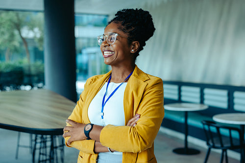 Confident businesswoman smiling in a modern office environment