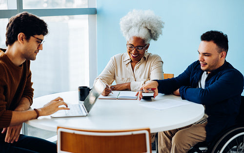 Business meeting with diverse team around table
