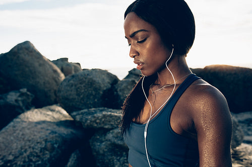 Tired female resting after intense workout