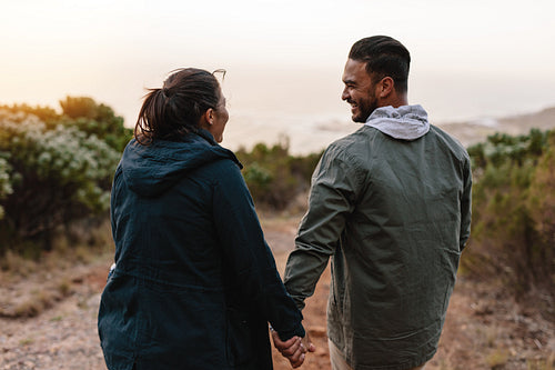 Young people walking through the country path