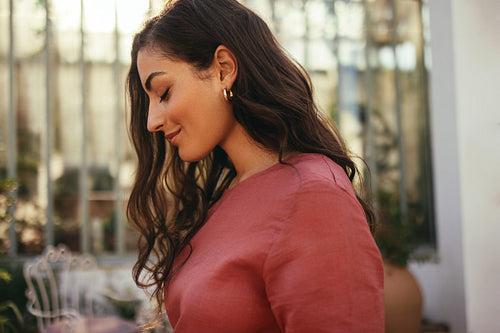 Beautiful young tourist woman standing alone outdoors
