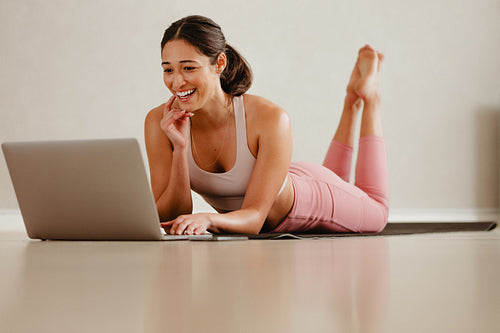 Fitness instructor connected with class over a video call