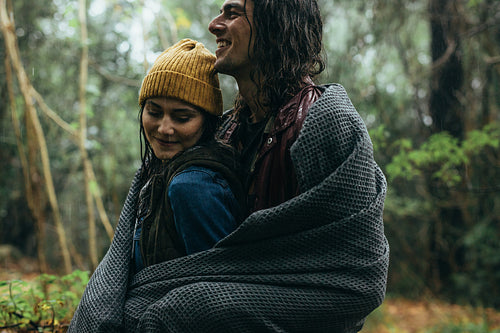 Couple enjoying their romantic outdoor date under rain