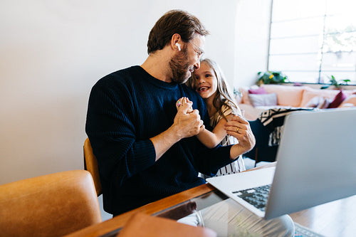 Father and daughter share loving moment on video call