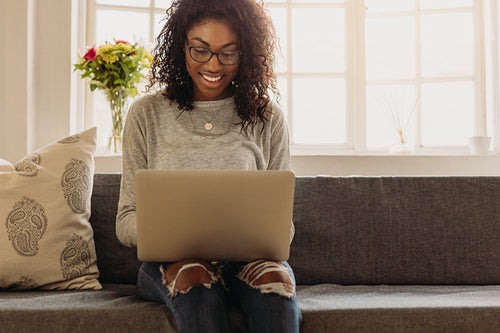 Businesswoman working from home on laptop