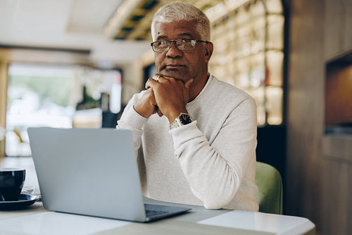 Mature entrepreneur working in a cafe