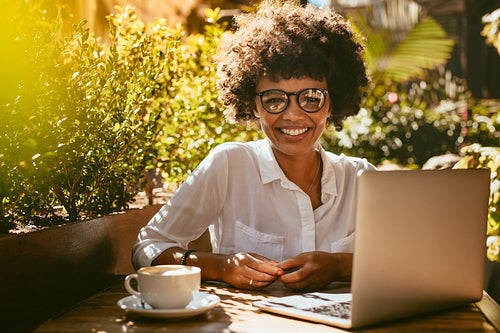 African woman at coffee shop