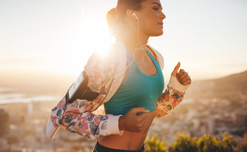 Fitness woman running outdoors