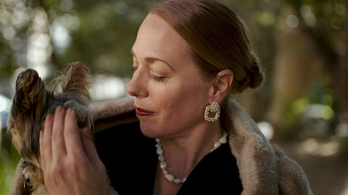 Rich woman portrait with her pet dog