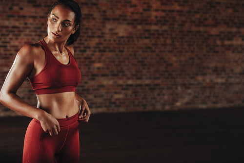 Sportswoman during workout break in gym