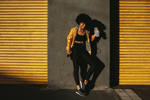 Smiling athlete taking break after workout