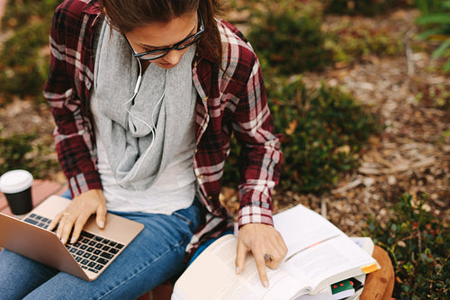 Girl student preparing for exams at college campus