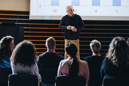 Speaker giving a motivational speech in corporate event