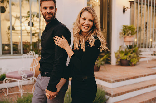 Happy couple going on a romantic getaway at a luxury hotel