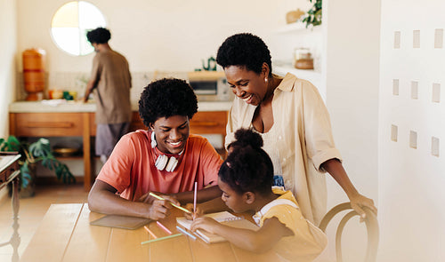 Happy family learning together in the kitchen