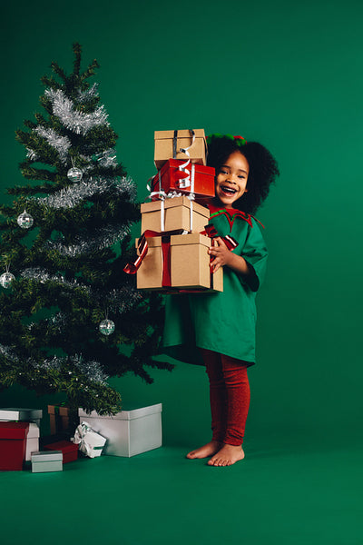 Little girl with her christmas gifts
