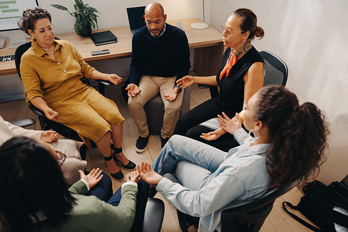 Team wellness activity featuring a breathing exercise in an office setting