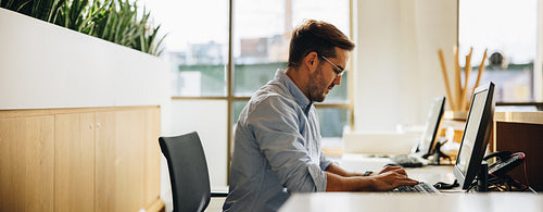 Businessman working computer in office