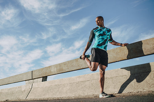 Sportsman warming up before a run