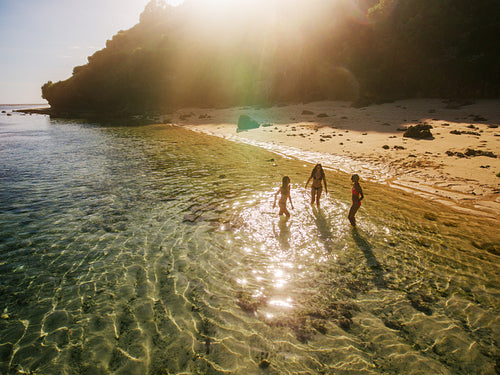 Female friends enjoying vacation on tropical beach