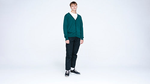 Caucasian man standing against white background