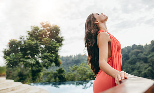Woman at resort enjoying the climate and fresh air