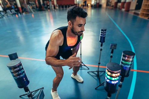 Athlete using visual stimulus system at sports lab