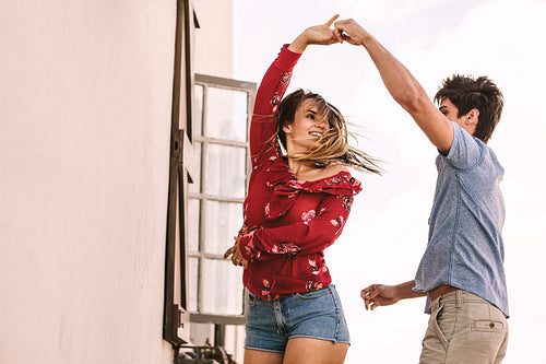 Couple dancing standing outdoors