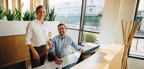 Business executives looking at camera