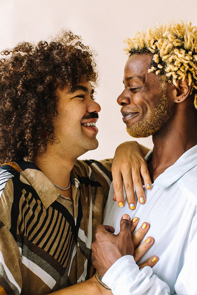 Gay couple smiling at each other