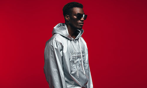 African american man in silver futuristic outfit