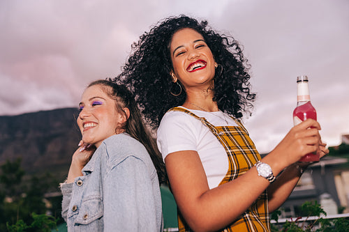 Best friends partying on a rooftop
