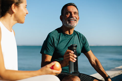 Senior man enjoying a healthy break outdoors by the sea