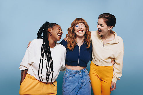 Group of girls laughing together in a studio