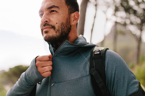 Healthy young male runner in sportswear