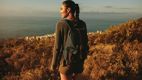 Woman walking on a country trail.
